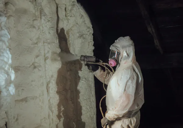 Spray foam crew working in a Massachusetts attic
