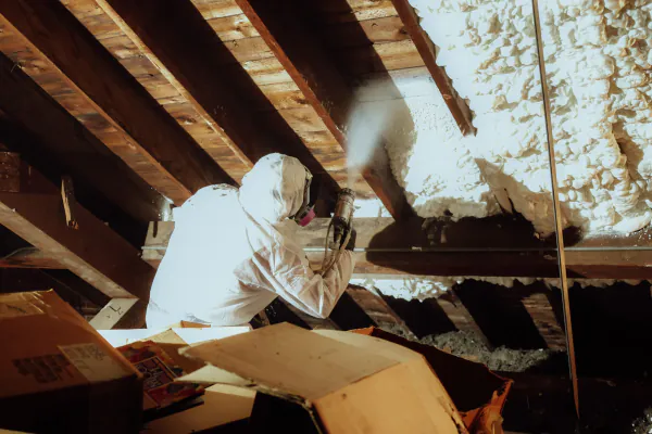 Spray foam application on an attic roof deck
