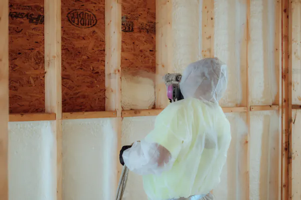 Patriot Spray Foam installer working in residential framing